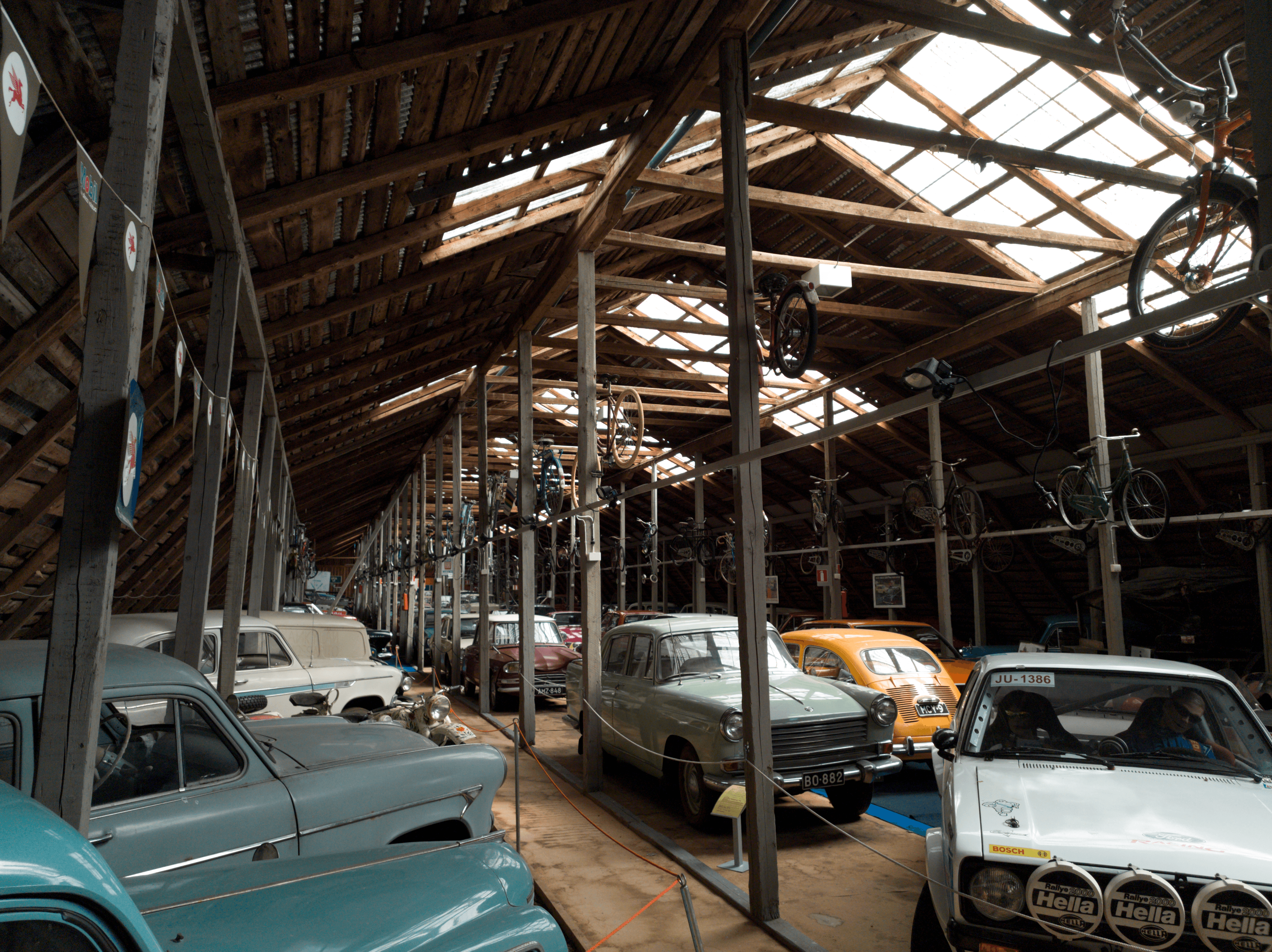 Collection of classic and vintage cars stored on the upper floor of a car museum